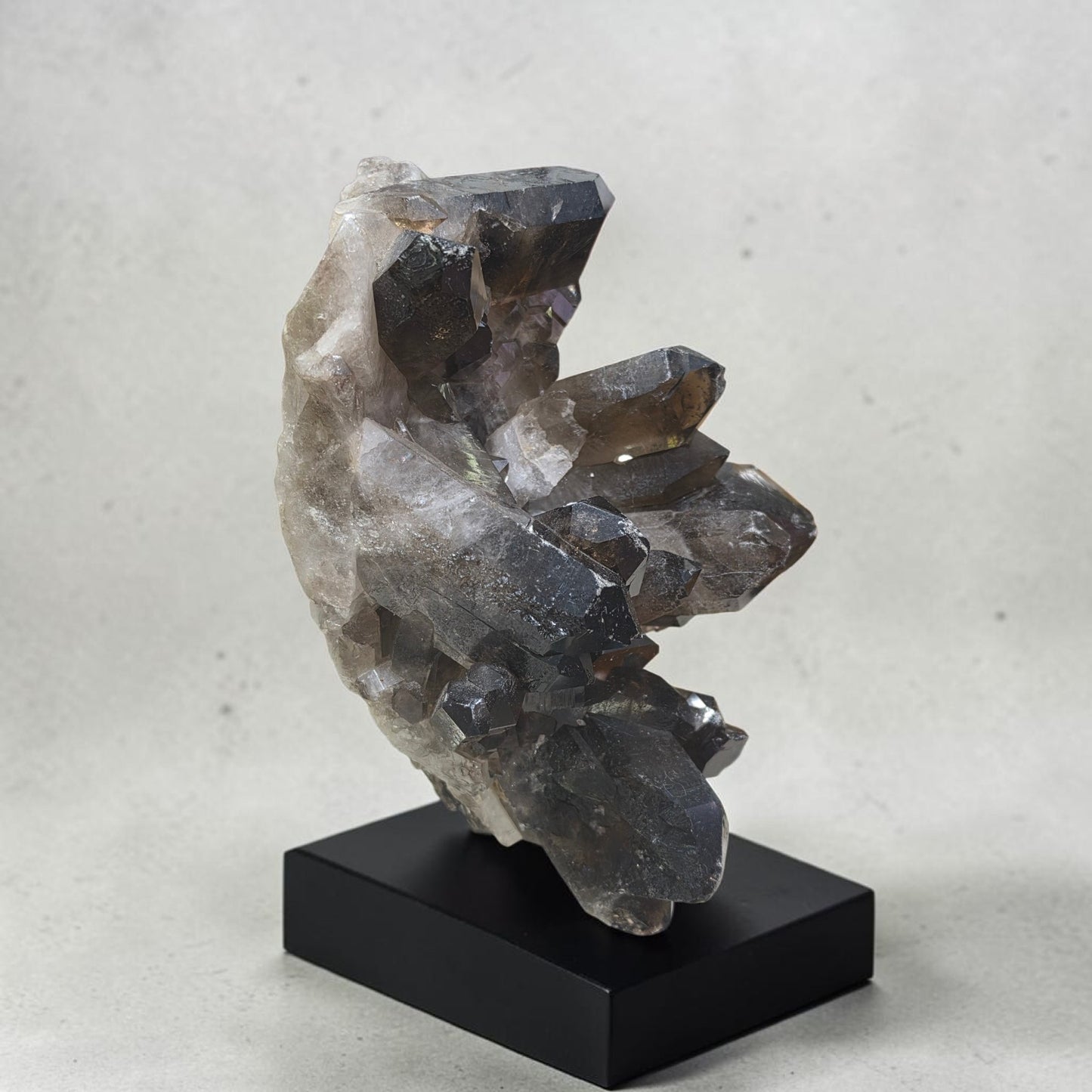 Huge raw smokey quartz on stand
